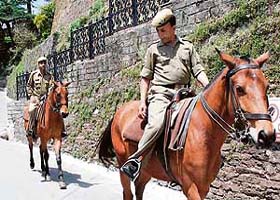 Policemen patrol The Mall in Shimla