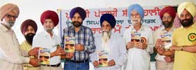 Members of the Puadhi Punjabi Sath during a book release function at Shivalik Public School, Mohali