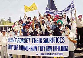 Ex-servicemen protest at the War Memorial in Chandigarh
