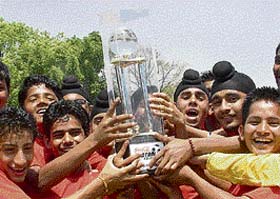 The jubilant team members display their trophy