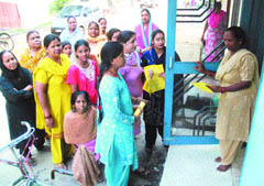 Supporters of a candidate distribute pamphlets in Jalandhar cantt on Sunday. 