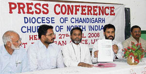 Waris Masih, vice-chairman of the Diocese of Chandigarh Churches of North India (centre) and Dr John Pramod address a press conference in Ludhiana on Sunday. 