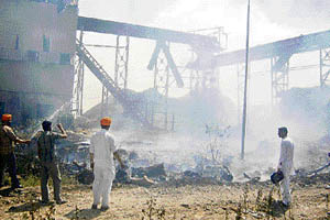 Villagers help douse fire in the Bhalapind cooperative sugar mill in Ajnala tehsil on Sunday.