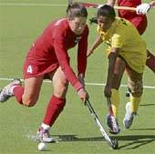 Asunta Lakra (R) of India vies for ball with Therese Noorlander of Netherlands Antilles during their womens field hockey Olympic qualifying match for third place in Kazan on Sunday. 