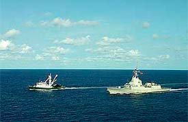 Spanish fishing boat Playa de Bakio (Left) is escorted by the Spanish frigate Mndez Nez, after being freed by pirates in waters of Somalia, on Sunday