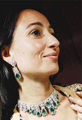 A model shows off an emerald and diamond necklace and earrings by the house of Taylor Jewellery in Dubai