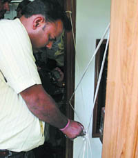 MCD officials seal the basement of a building at Vikarm Vihar, South Delhi, in the Capital on Monday. 