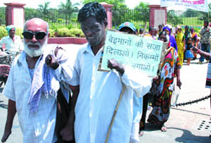 Leprosy patients march from Raj Ghat to Delhi Secretariat under the banner of Federation of Leprosy Organisation. Their demands include issue of ID cards as per the High Court orders, in the Capital on Monday.