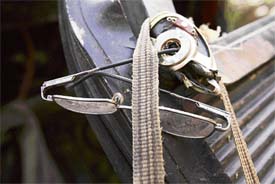 The spectacles of a schoolgirl hang from the windowpane of an overturned bus which met with an accident in Jammu on Monday.