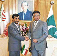 Pakistan President Pervez Musharraf shakes hands with Iranian counterpart Mahmoud Ahmadinejad as he stops over in Islamabad on Monday.