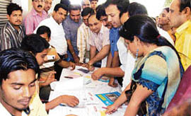 A huge rush of applicants as they await their turn to get the applications processed for the CHB housing scheme at Axis Bank in Sector 17, Chandigarh, on Tuesday.