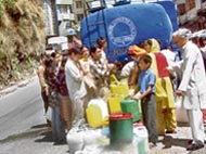 Water tankers of the Shimla Municipal Corporation supply water to residents near the Chakkar area in Shimla