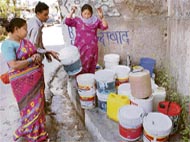 people wait for water in New Shimla, Sector 2