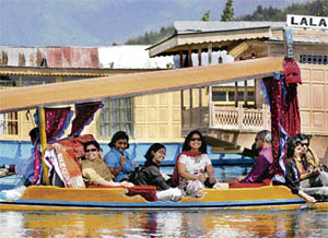 Tourists enjoy a shikara ride in the famous Dal Lake in Srinagar on Tuesday.
