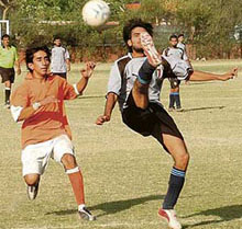 A player tries to hit a pedal kick during Sher-e-Punjab Trophy at Football Stadium, Sector 17, Chandigarh, on Wednesday.
