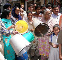 Residents protest against erratic water supply at B.C. Bazaar in Ambala on Wednesday.