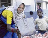 Unaware of the significance of May Day, a woman works at a construction site in Karnal.