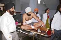 One of the victims of a clash between two groups of the National Conference in Government Medical College and Hospital in Jammu on Wednesday.