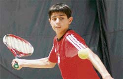A participant in action during the PAU AITA Total Tennis Talent series tournament being held at PAU in Ludhiana.