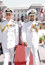 New Vice-Chief of Naval staff R.P. Suthan (right) is escorted by outgoing incumbant Vice-Admiral Nirmal Verma during the guard of honour in New Delhi