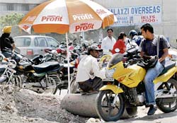 A contractors employee issues tickets at an unauthorised parking lot in Sector 34, Chandigarh, on Thursday.