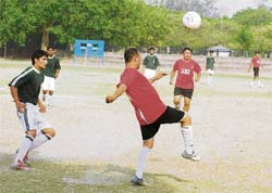 A football match in progress at the Sector-17 football stadium in Chandigarh on Thursday.