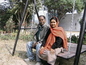 Suresh Chauhan with his wife Jyotsna at their house in Santokh Majra village
