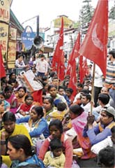 Indian Trade Unions (CITU) stage a rally to commemorate May Day at Lower Bazar in Shimla on Thursday.