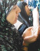 Women offer prayers at the shrine of Hazrat Shaikh Dawood (RA) at Batamaloo in Srinagar