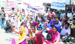 Members of the Rural Health Pharmacists Association hold a dharna in front of the residence of Manoranjan Kalia in Jalandhar