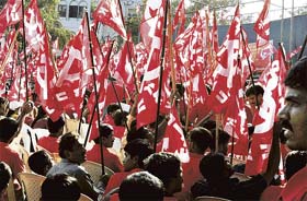 Trade unionists and Left party activists participate in a march marking the 119th International Labour Day in Bangalore