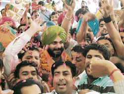 BJP workers welcome Navjot Singh Sidhu at the Amritsar railway station on his return to the city after about three months, on Thursday.