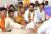 Candidates of different political parties like SAD ( left), BJP (middle) and Congress (left), along with their supporters, submitting their nomination forms to ADC Upjeet Singh Brar in Bathinda on Friday. The elections are slated for May 12. Tribune photos: Malkiat Singh