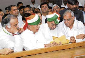 Congress nominee from Indri Bhim Sain Mehta (second from right) files his nomination papers in the presence of Chief Minister Bhupinder Singh Hooda in Karnal