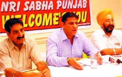 Members of the NRI Sabha address a press meet in Jalandhar on Friday. 