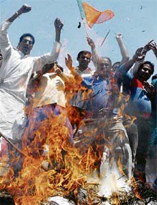 BJP activists burn an effigy of the Congress-led UPA government in Jammu