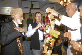 National Conference patron Farooq Abdullah welcomes senior PDP leader Sonaullah Dar into the party fold in Srinagar