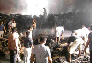 Villagers try to put out a fire at the rice sheller at Pohir village near Ahmedgarh on Friday. 