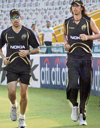 Kolkata Knight Riders pacers Umar Gul (L) and Ishant Sharma warm up on Friday ahead of the DLF IPL match against Kings XI Punjab scheduled at the PCA Stadium on Saturday.