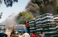 TV sets stacked outside a factory after it caught fire in Mohali on Saturday.