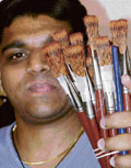 Gaurav Gupta of the People For Animal shows illegal paintbrushes made from mongoose tail hair at the police station-19, Chandigarh, on Saturday.
