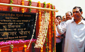 Delhi urban development and PWD minister Rajkumar Chauhan lays stone of special classrooms for girls at Mangolpuri in the Capital on Saturday. 
