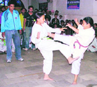 Participants in action on the opening day of the All-India Ashihara Karate Championship organised in Ludhiana on Saturday.