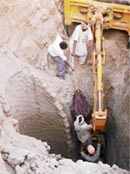 Rescue workers pull out the body of 65-year-old labourer Surjan Singh, who died after he fell into a 30-ft-deep well at Jahlan village, 7 km from Patiala
