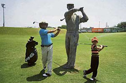 Harinderpal Singh Bedi and his seven-year-old son Aadil practice at the Chandigarh Golf Range on Sunday.
