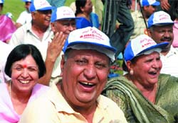 LIFE IS ALL HA HA, HEE HEE: Members of a laughter club participate in a yogic exercise on World Laughter Day at Connaught Place Central Park in the Capital on Sunday