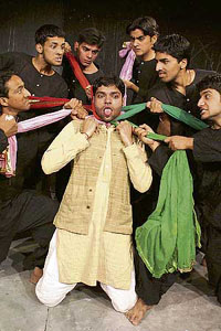 Artistes of Natarang Theatre Group stage Bharat chodo play in Jammu on Sunday.