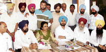 School principal Kanwaljit Kaur Bal along with politicians and residents talks to mediapersons in Ludhiana.