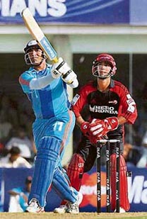 Mumbai Indians' Robin Uthappa hits a six against Delhi Daredevils during the IPL T20 match at the D Y Patil Sports Stadium in Nerul, Mumbai, on Sunday.