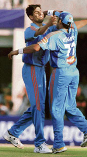 Mumbai Indians' Ashis Nehra and Robin Uthappa celebrate the dismissal of Delhi Daredevils' Gautam Gambhir during the IPL T20 match on Sunday. Nehra took 3 wickets.
